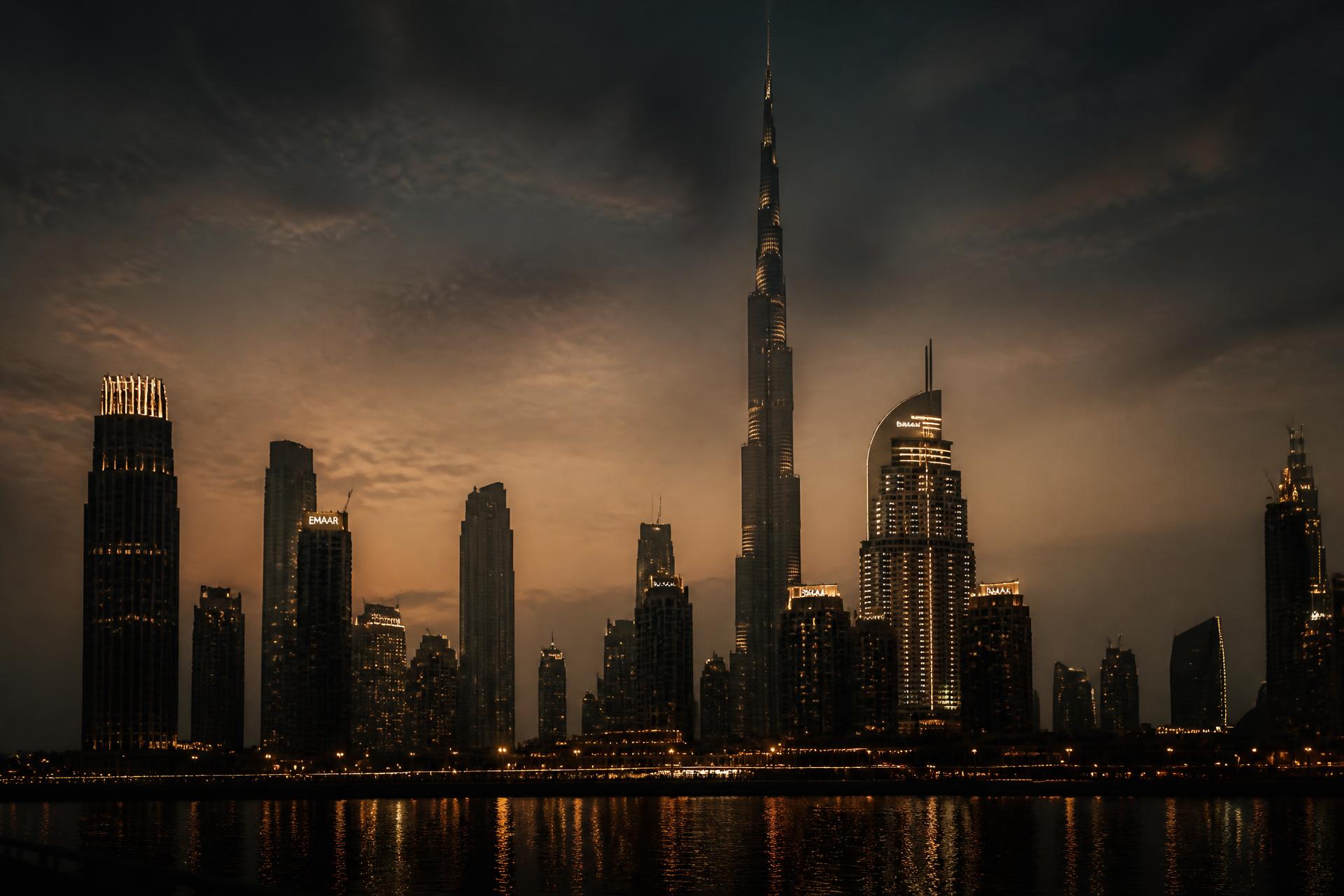 Dubai skyline at dusk seen across the water